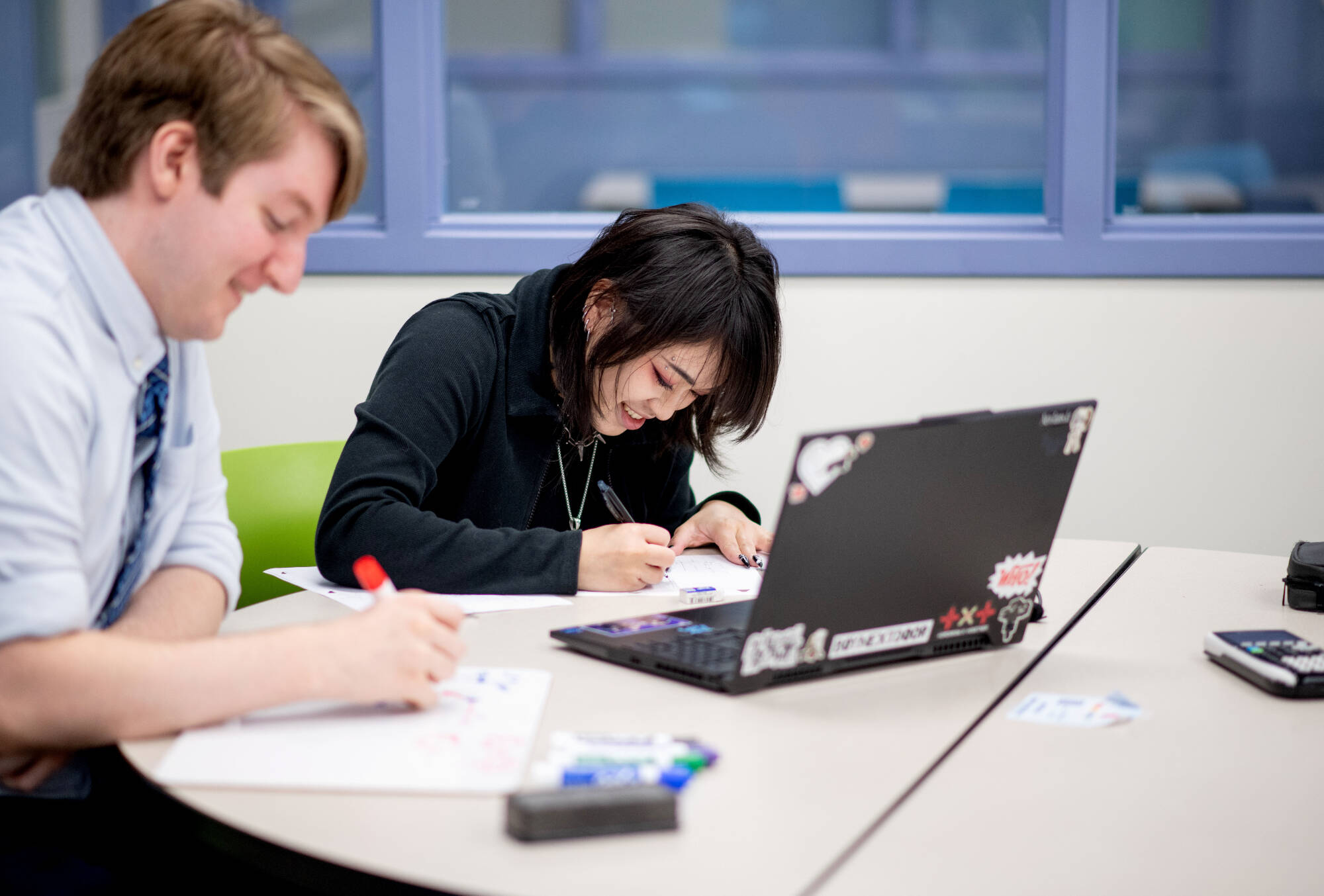Benjamin Brown, left, tutors Leeza Souvongkham, right,  in physics in the new Tutoring and Reading Center in Henry Hall September 27.(Photo releases on file)